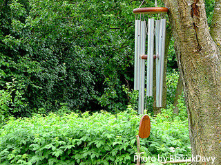 Aluminum metal tube windchimes with wooden top and striker hung on tree in garden, aluminum tube wind chimes, large metal wind chimes.