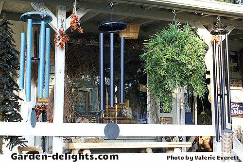 Beautiful sounding low tone windchimes with metal topper matching colored center striker and matching colored windcatcher for the best feng shui, garden windchimes, patio decor, dreamcatchers windchimes, whimsical windchimes colorful windchimes, powder coated colored light blue, purple, black, green windchimes.