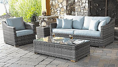 Outdoor wicker furniture, Outdoor garden furniture, light brown outdoor wicker furniture with blue patio cushions.