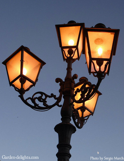  Antique, classic wrought iron post four lantern garden lighting with box lights and glass sides with decorative top, outdoor post lights, solar lamp post light, deck lighting, front entrance way lighting, Home Depot.