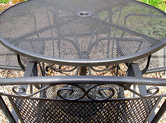 walmart outdoor patio furniture, close up picture of black metal mesh patio furniture set with four chairs.