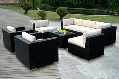  Outdoor Wood furniture, seven piece Wicker outdoor living furniture set with white cushions and center table.