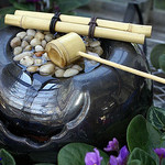 Best Tabletop Water Fountains,table fountain wit bamboo sticks accross top.