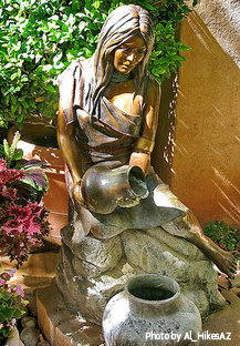 Ceramic water maiden holding water jug and pouring water into lower ceramic vase, ceramic water garden statues, decorative water fountains.