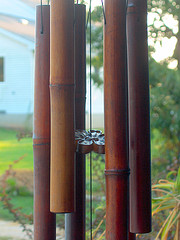  bamboo wind chimes, feng shui wind chimes, bamboo tube wind chimes hanging outside on tree.