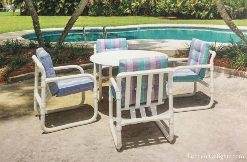 Four PVC pipe patio furniture chairs with white PVC table and striped pastel color furniture cushions, PVC furniture projects, innovative outdoor furniture.