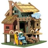 Beach resort birdhouse with bamboo roof and surfboards on railing, custom-made birdhouses, decorative bird house.