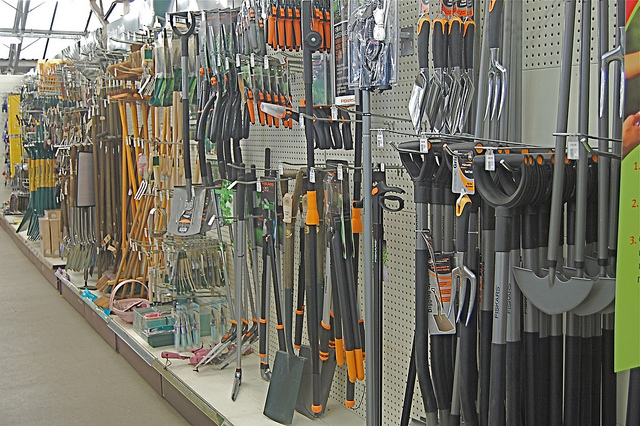 Gardening tool center with shovels and trials hanging on the wall, garden tool gift sets, gardening tool names.