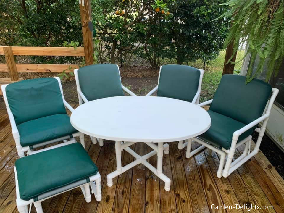 Four PVC chairs with blue, green cushions with large white table and matching patio PVC footstool, PVC patio furniture, building PVC patio furniture, PVC pipe furniture.