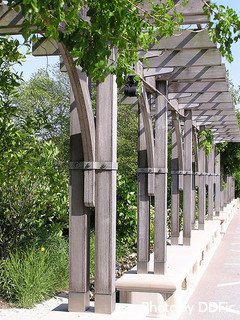 Multiple arbors with Pergola tops with vines and flowers, large garden arbors, small garden arbors.