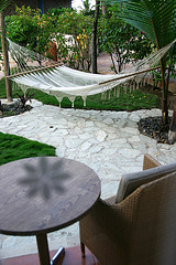 Outdoor hammocks, outdoor deck hammocks,White rope hammock on patio.